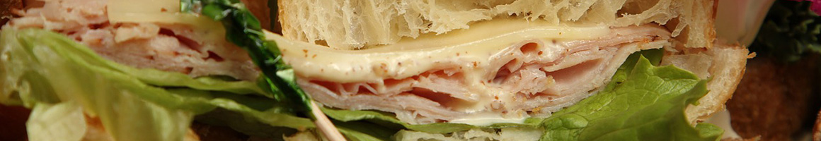 Eating Sandwich at Quinn's Jockey Cap Country Store restaurant in Fryeburg, ME.